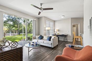 Spacious Living Room with Grey Hardwood Style Flooring