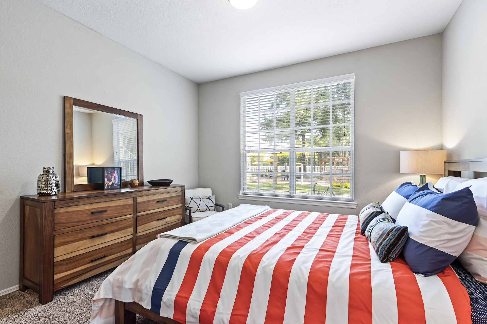 Bedroom with Grey Walls and Plush Carpeting