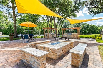 Outdoor Fire Pit Area with Built-In Stone Seating - Photo Gallery 25