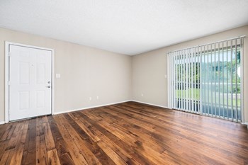 Living Room Area With Wood-Style Flooring & Glass Sliding Patio Door With Built-In Blinds - Photo Gallery 33