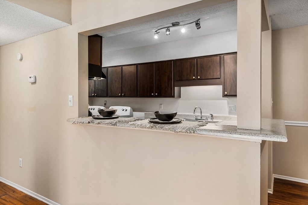 Kitchen With Peek Through Window With Breakfast Bar