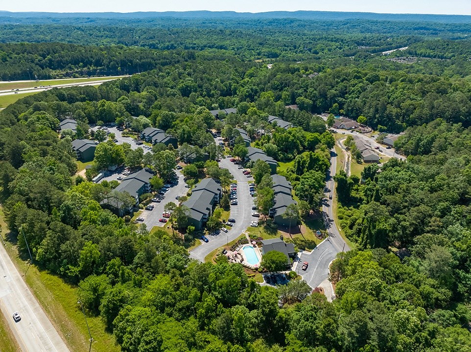 Aerial View Of The Halston Apartment Community With Pool