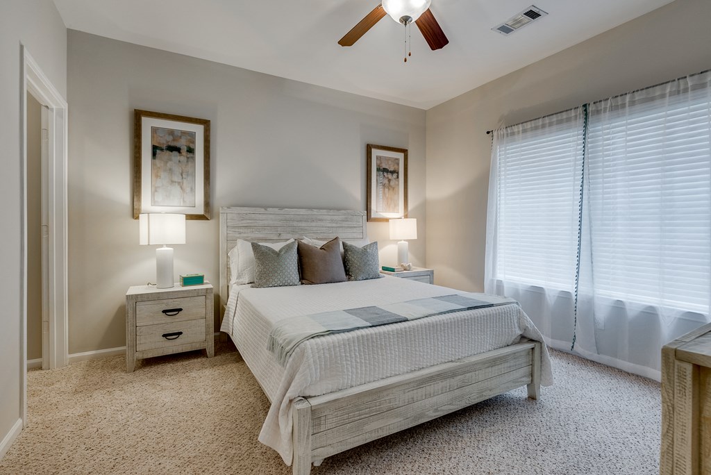 Carpeted Bedroom With Tall Ceilings