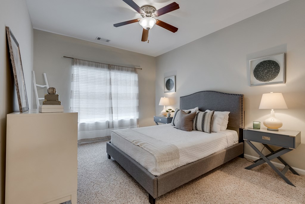 Bedroom With Tall Ceilings & Large Windows