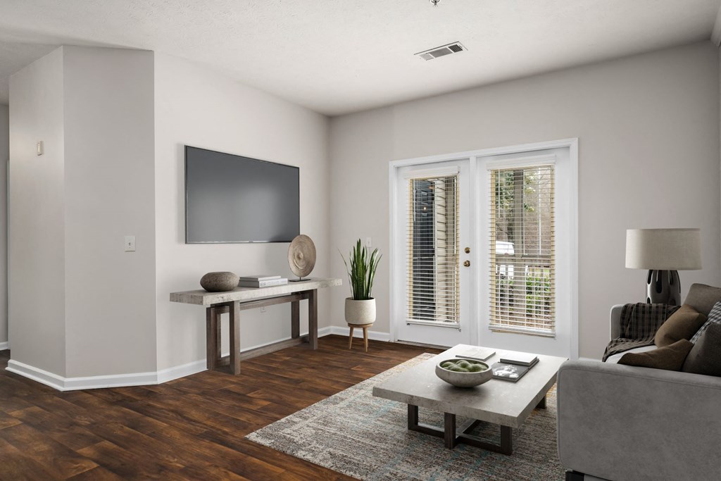 Spacious Living Area With Wood-Style Flooring
