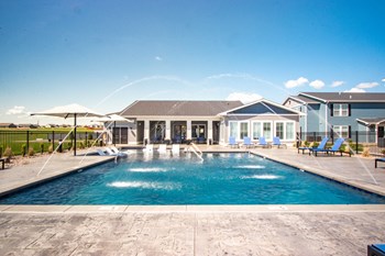 Spacious Pool With Lush Landscaping Surrounding - Photo Gallery 2