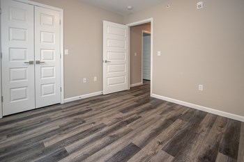 Bedroom With Wood-Style Flooring & White Trim - Photo Gallery 36
