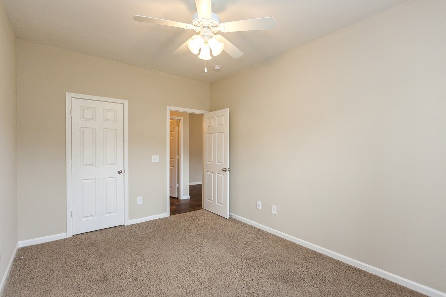 Bedroom with Ceiling Fan and Light
