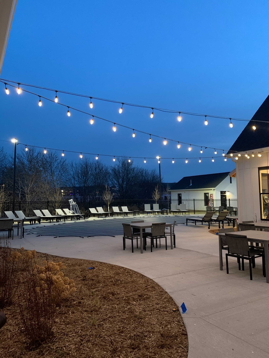 Outdoor Sundeck Lounge Under Twinkling Lights