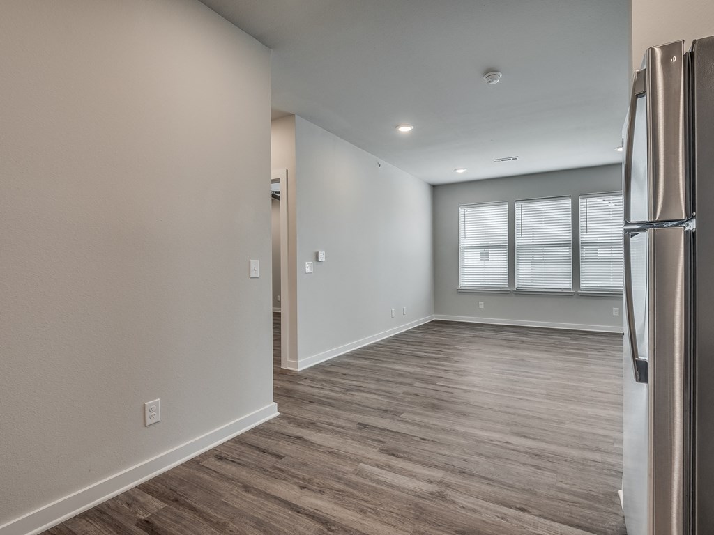 Spacious Living Area With Wood-Style Flooring
