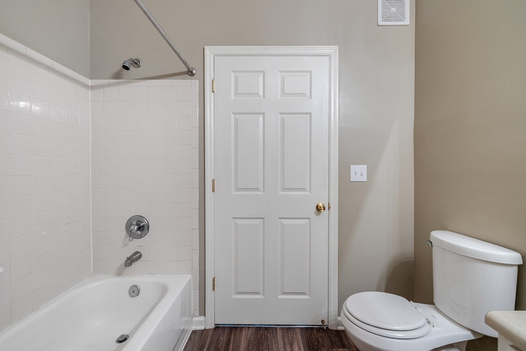 Bathroom With Wood-Style Flooring & Shower With Tub
