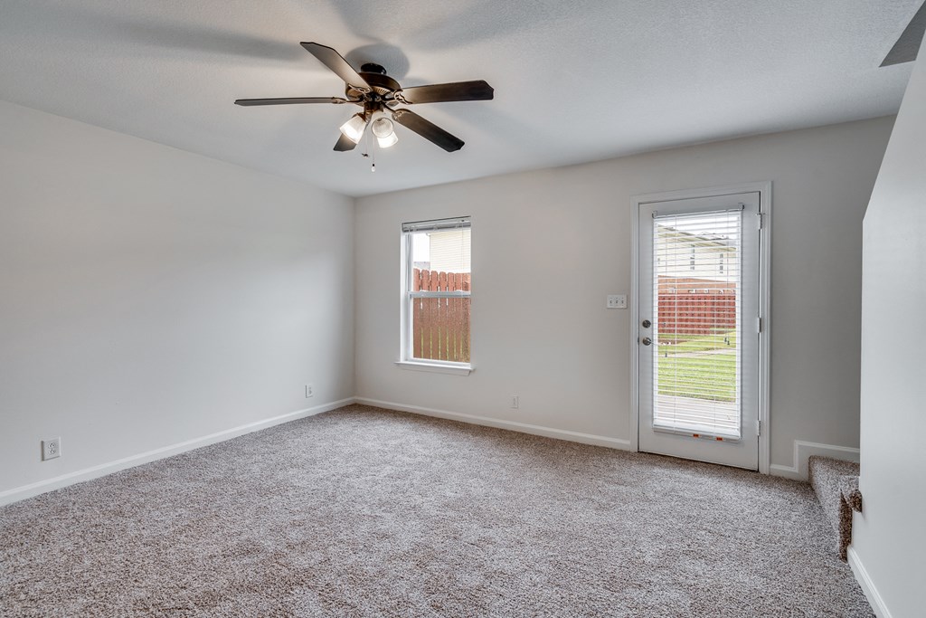 Carpeted Living Room With Lots Of Natural Light