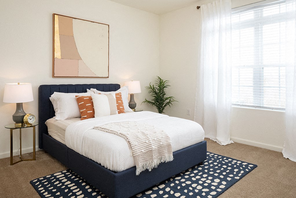 Spacious Bedroom with Large Window that lets in Lots of Natural Light