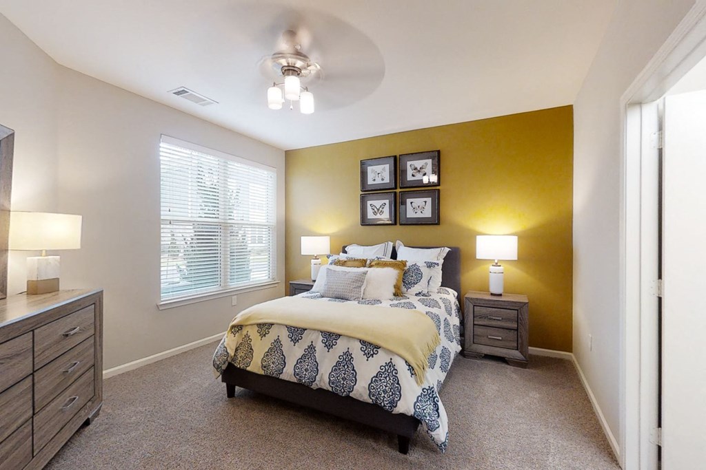 Spacious Bedroom with Large Double Windows and Ceiling Fan with Light