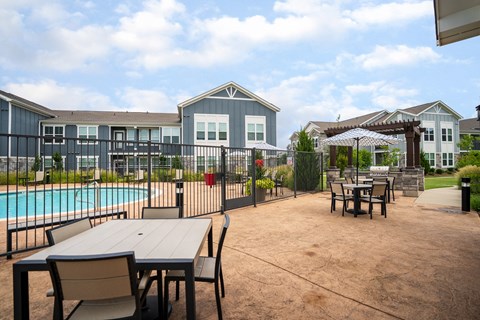 Outdoor Terrace Area Overlooking the Fenced In Pool