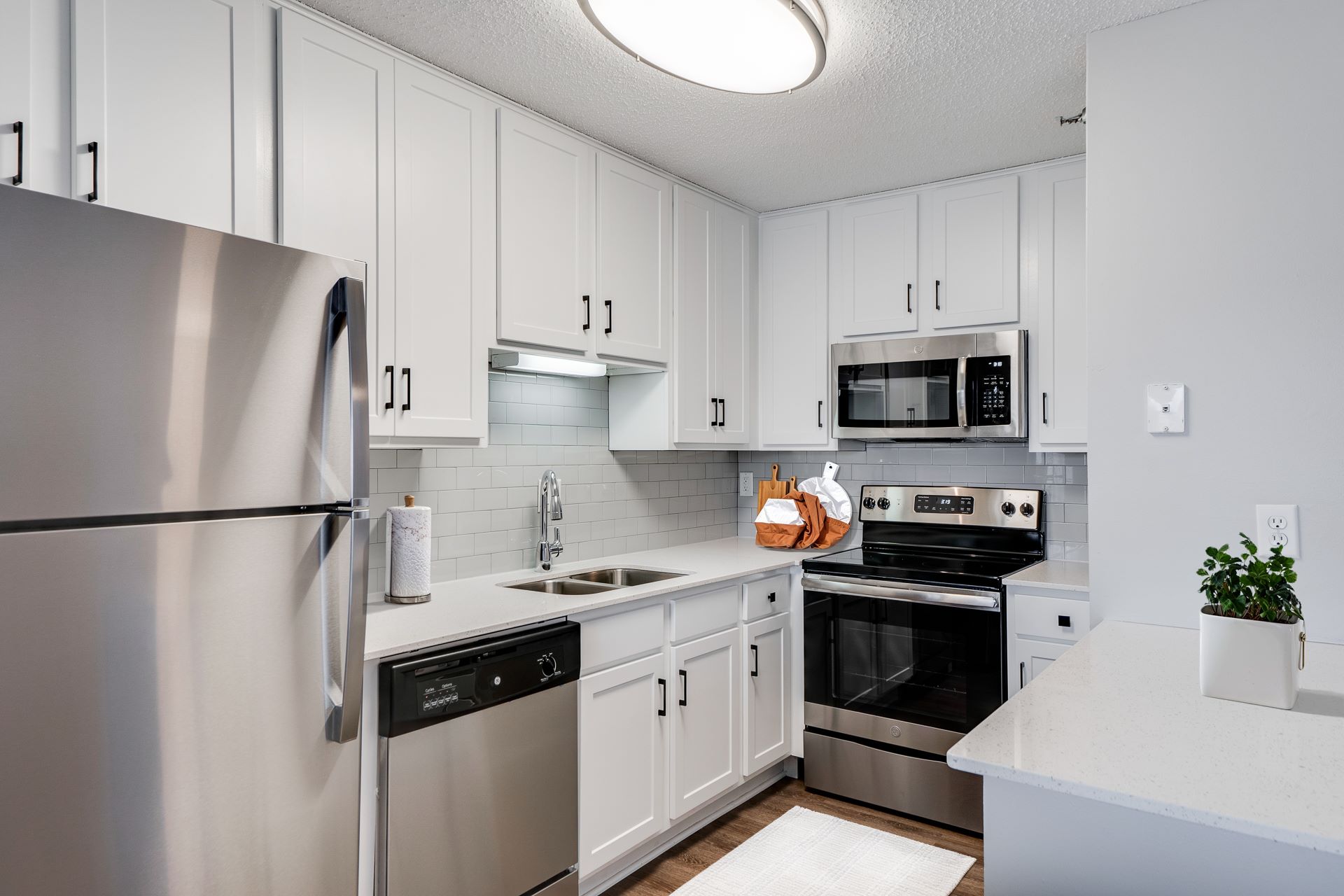Fully Equipped Kitchen with white cabinets