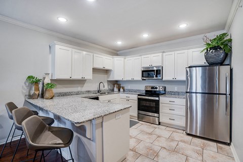 Open Kitchen with White Cabinetry