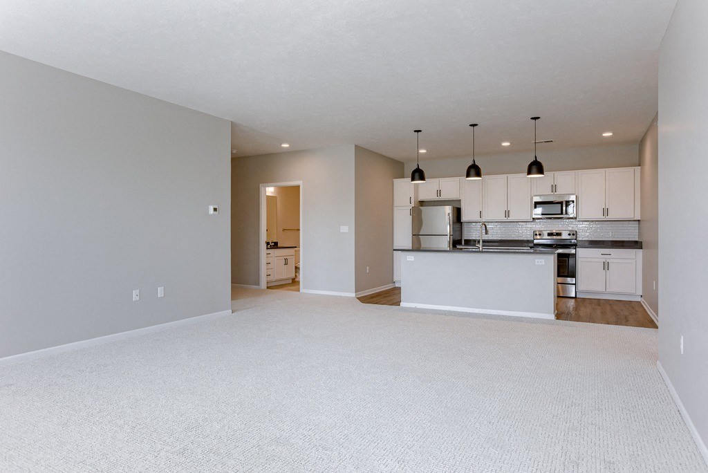 Spacious Living Area with Carpet