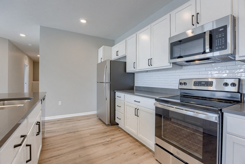 Kitchen with White Cabinetry and Stainless Steel Appliances