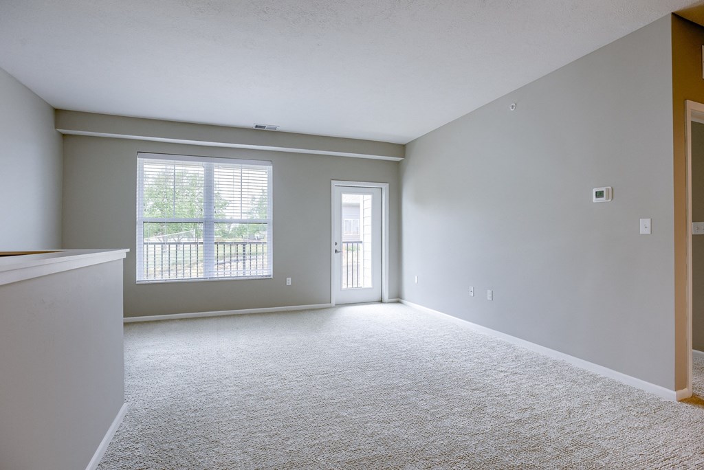 Spacious Living Area with Carpet