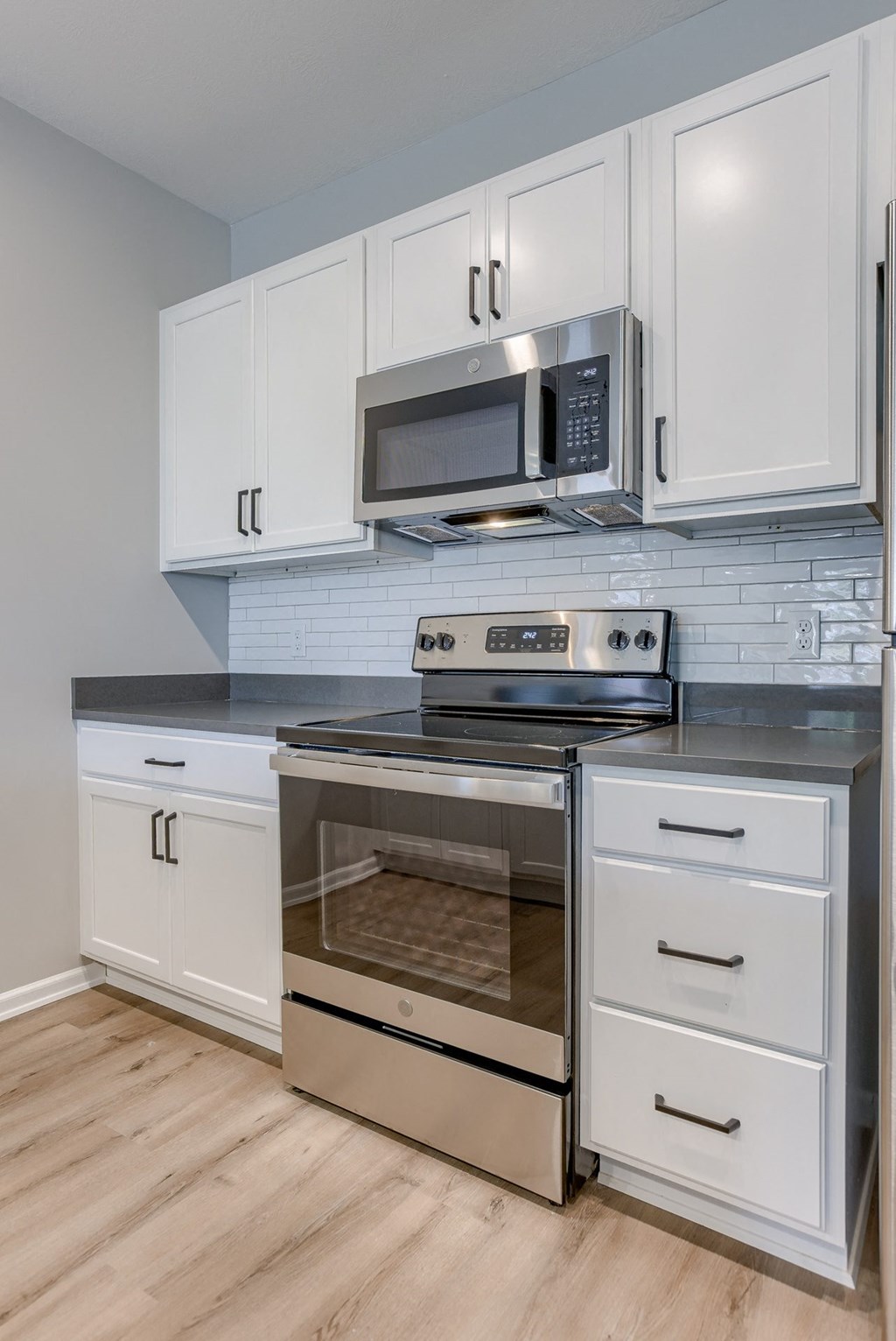 Kitchen with White Cabinetry and Stainless Steel Appliances