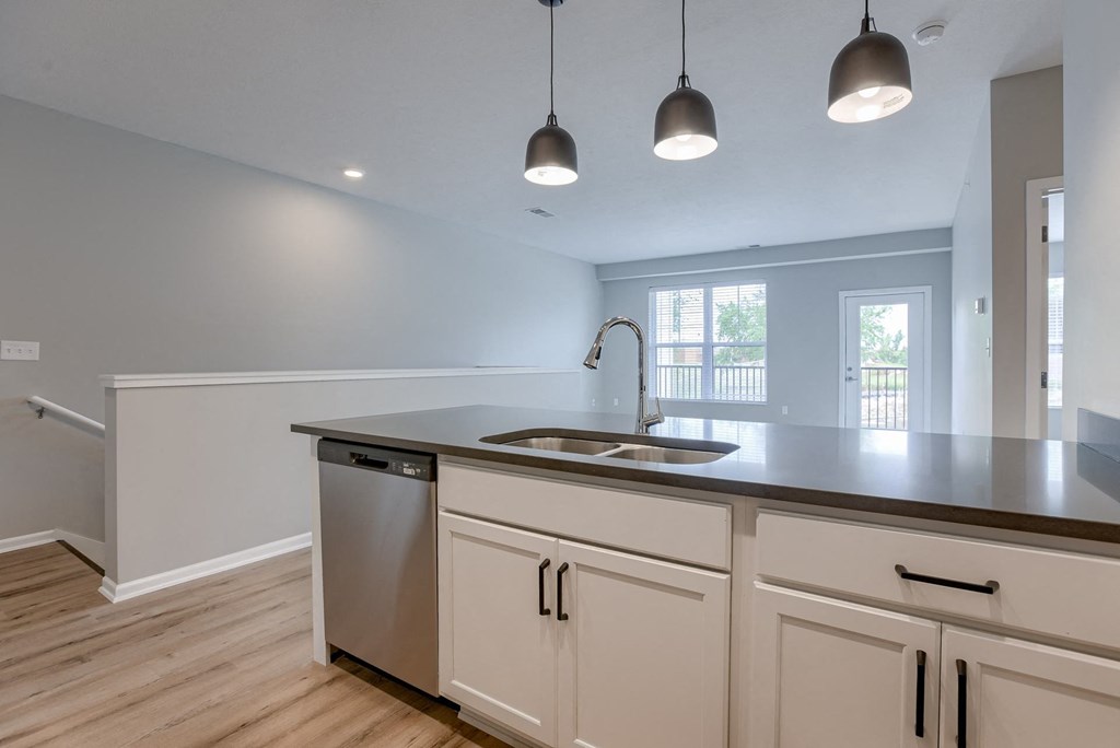 Kitchen with White Cabinetry and Stainless Steel Appliances