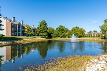 Apartment Homes at Pelican Cove Overlooking the Pond with Fountain - Photo Gallery 3
