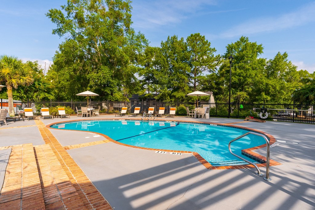Outdoor Pool & Sundeck With Lounge Chairs