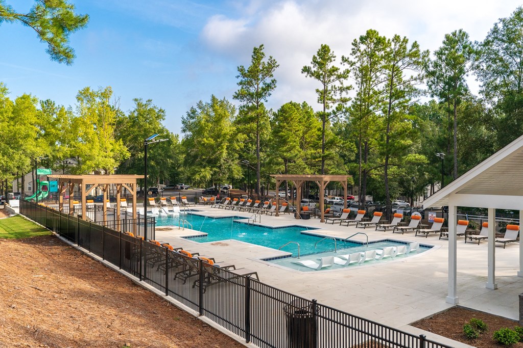 Expansive Pool Sundeck With Pergolas