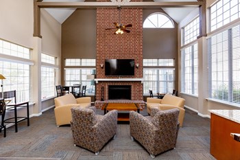 Clubhouse Lounge with Mounted TV and Fireplace - Photo Gallery 2