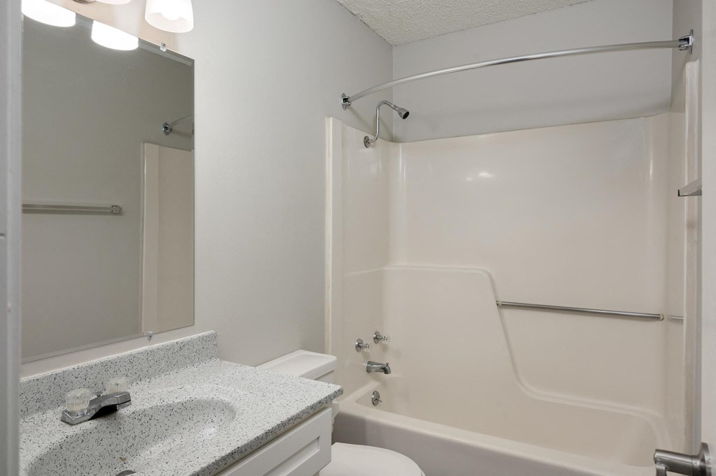 Bathroom With Light Grey Walls & Shower With Tub