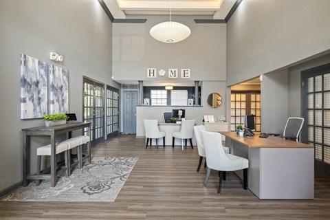 a living room and dining room with a table and chairs