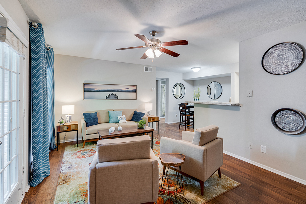 Living Room with Tall Ceilings and Ceiling Fan with Light