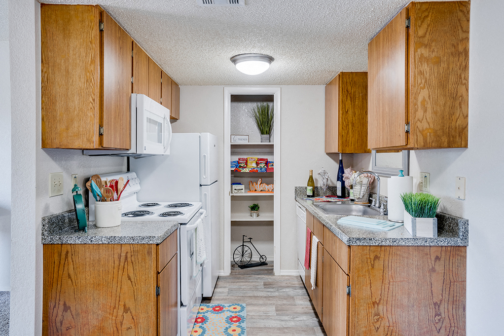 Kitchen with White Appliances and Pantry Closet