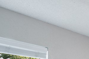 Bedroom with Large Window and Ceiling Fan with Light