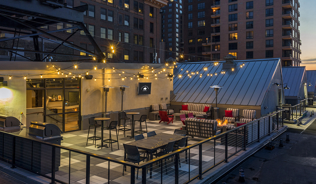 Rooftop Patio with fire pit and big screen TV