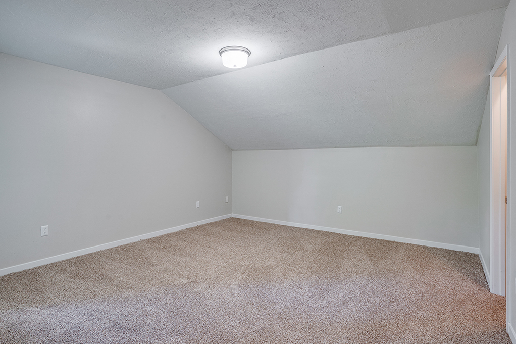 Spacious Bedroom with Plush Carpet