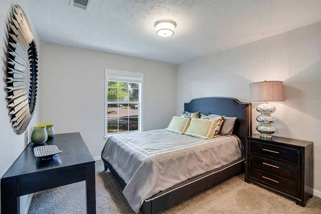 Bedroom with Tall Ceilings and Large Window