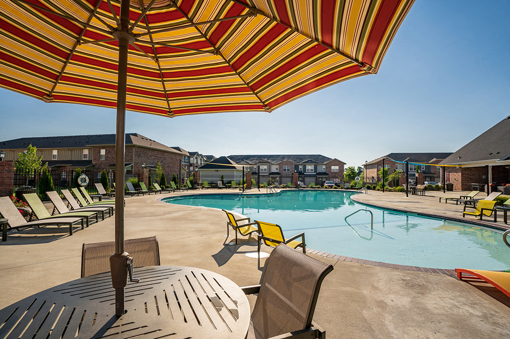 Patio Table with Sun Umbrella at the Pool Deck