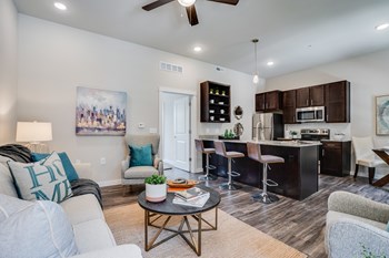 Open Concept Living Room and Kitchen with Rich Plank Flooring - Photo Gallery 3