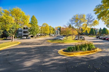 Parking Lot In Front Of Apartment Homes At The Apex - Photo Gallery 46