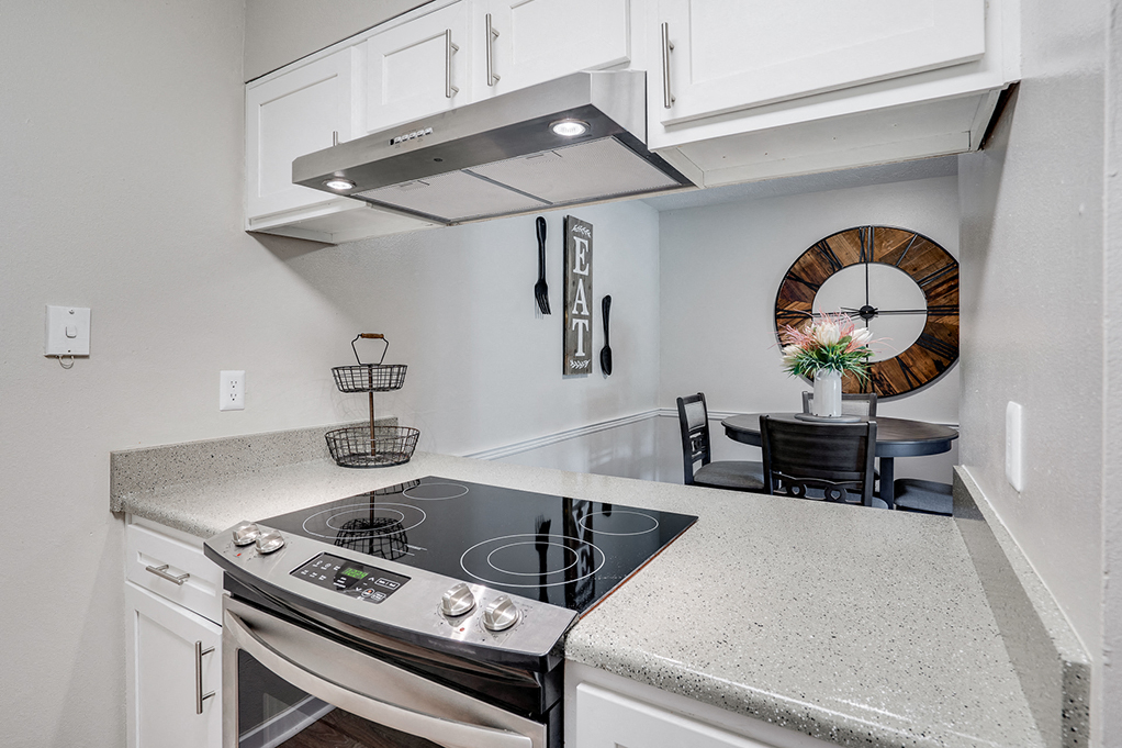 Stainless Steel Stove Overlooking the Dining Room Area
