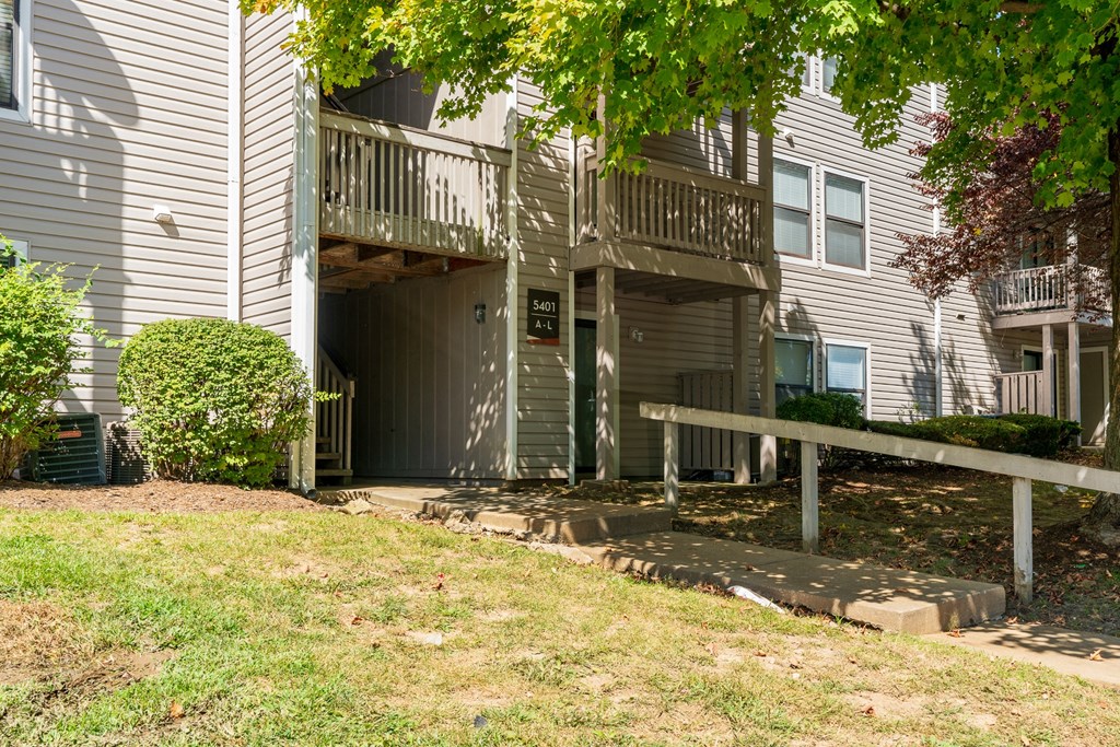 Paved Walkway Leading up to an Apartment Building at The Finn