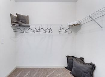 Walk-In Closet With Built-In Shelving