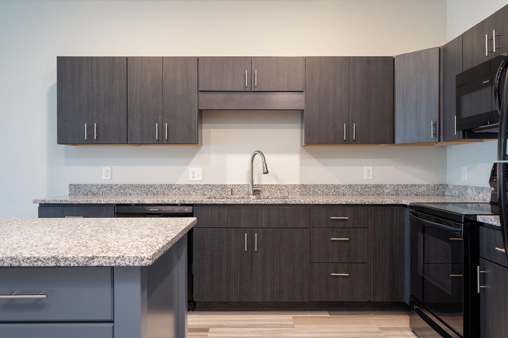 Kitchen Featuring Lots Of Cabinetry & Granite Countertops In The Starling Floor Plan