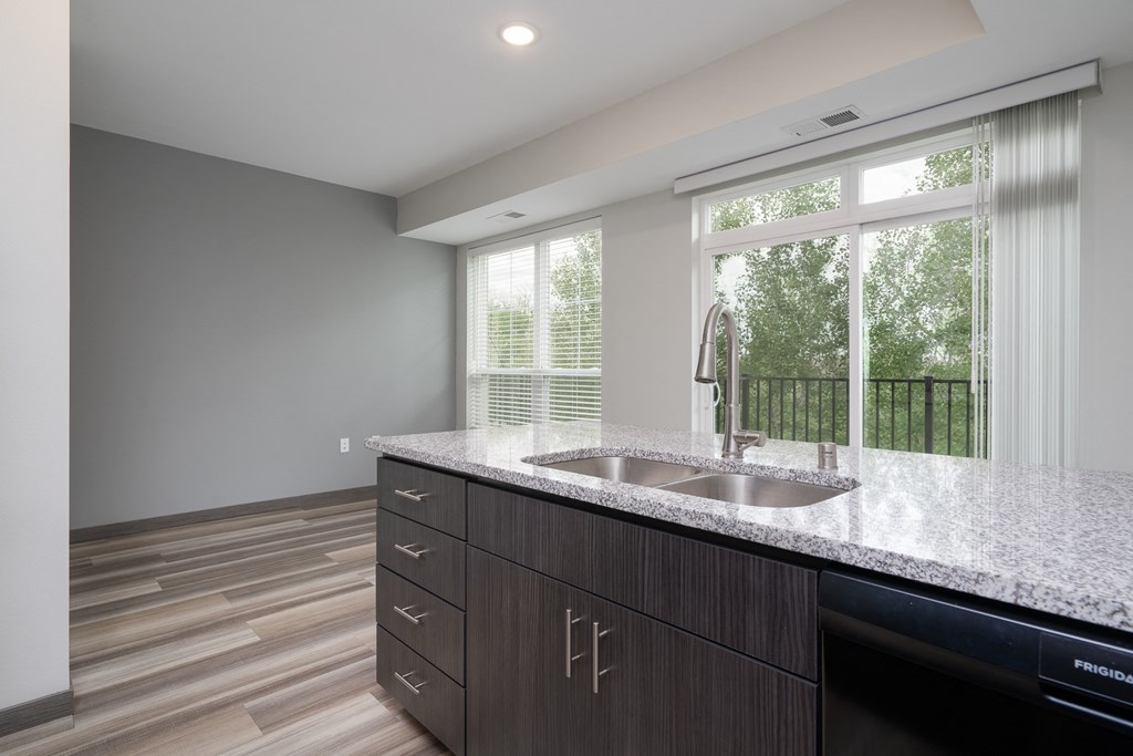 Kitchen Island Featuring Stainless Steel Sink In The Lark Floor Plan