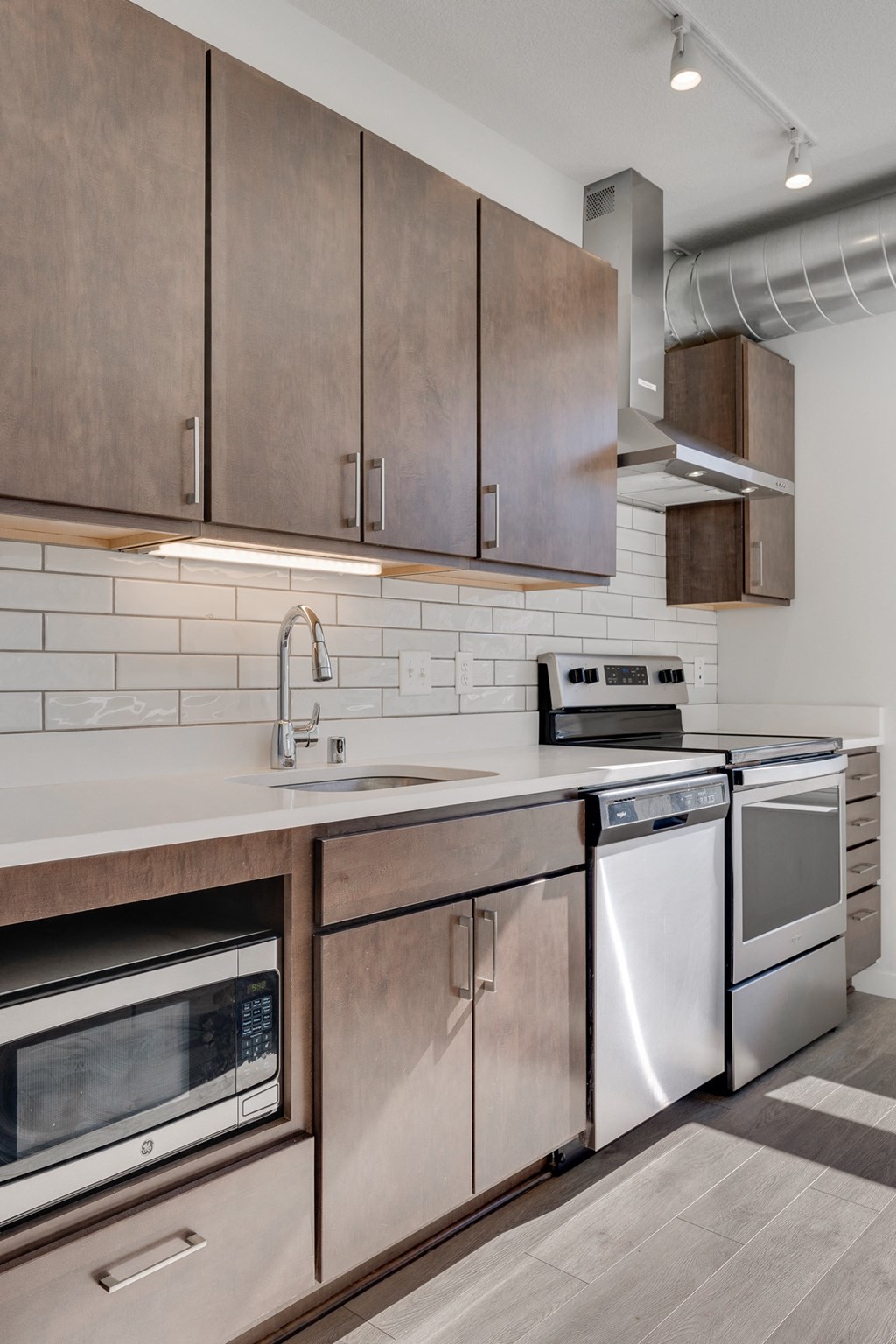 Kitchen with white countertops and stainless steel appliances