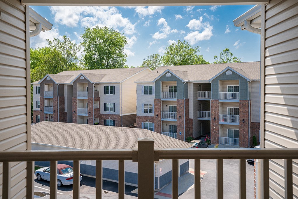 a view of an apartment building from a balcony