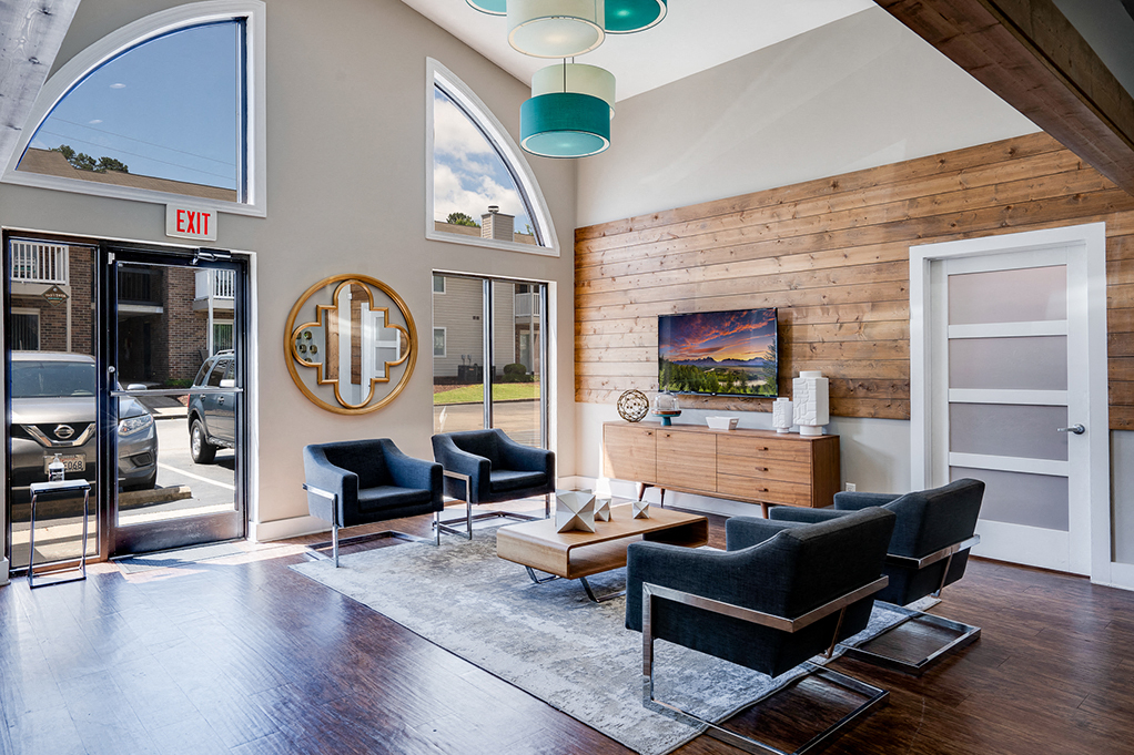 a living room with furniture and a large window