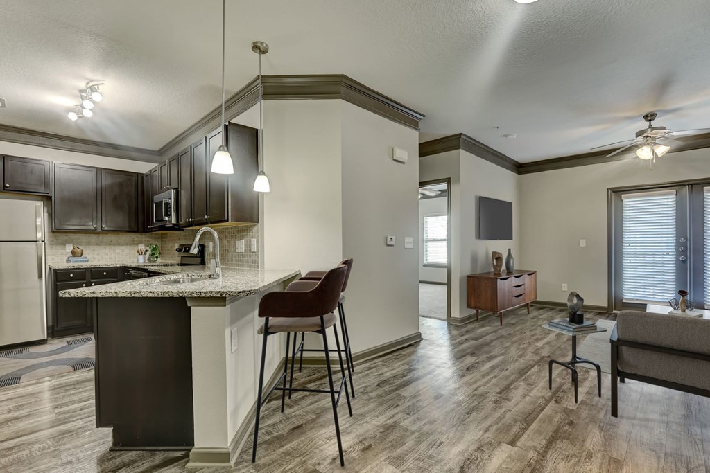 Kitchen with Dark Brown Cabinetry and Stainless Steel Appliances